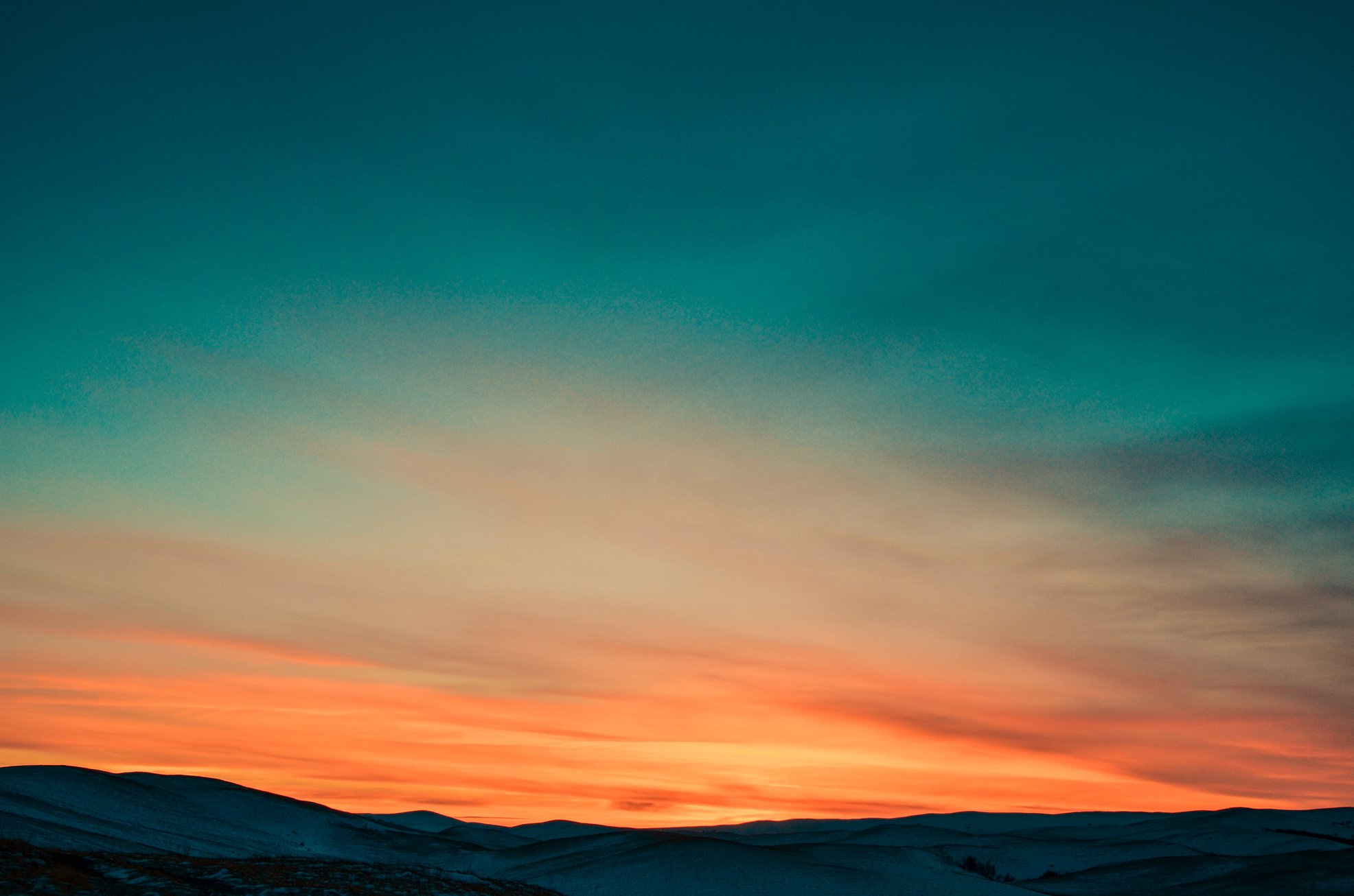 Sunset over Snow Covered Mountains